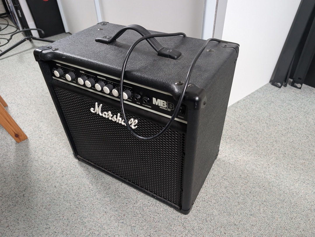 A Marshall MB series bass combo amplifier standing on a studio floor, showing the size of a typical home and rehearsal bass rig